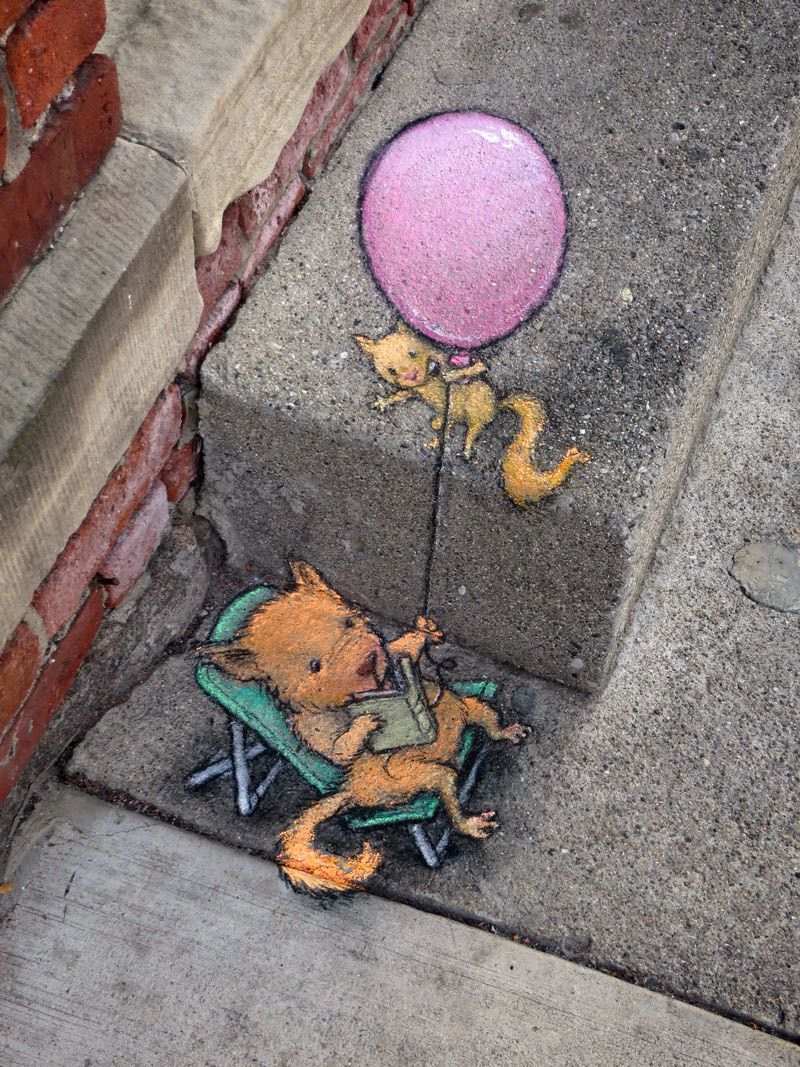 Mouse with a book and balloon - street lamp chalk artwork by David Zinn