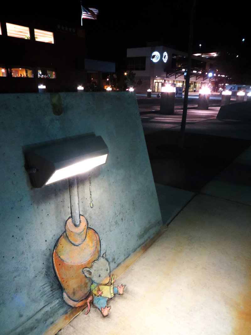 Mouse reading a book under the street lamp - chalk artwork by David Zinn