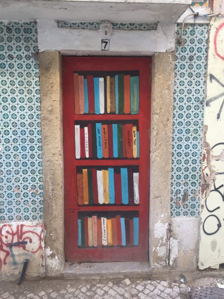 Street art in Setúbal, Portugal - bookshelf instead of the door